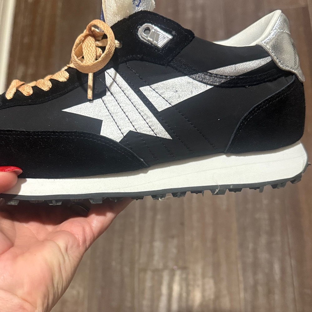 Black and silver sneakers .